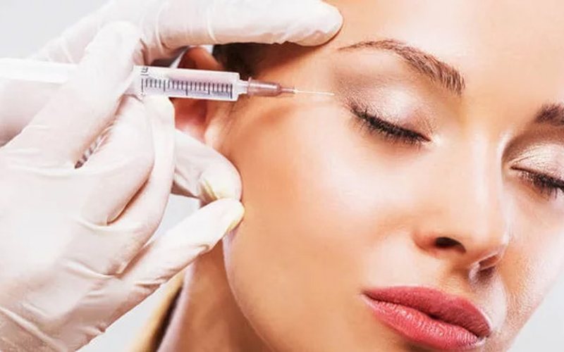 Botox treatment being administered to the forehead