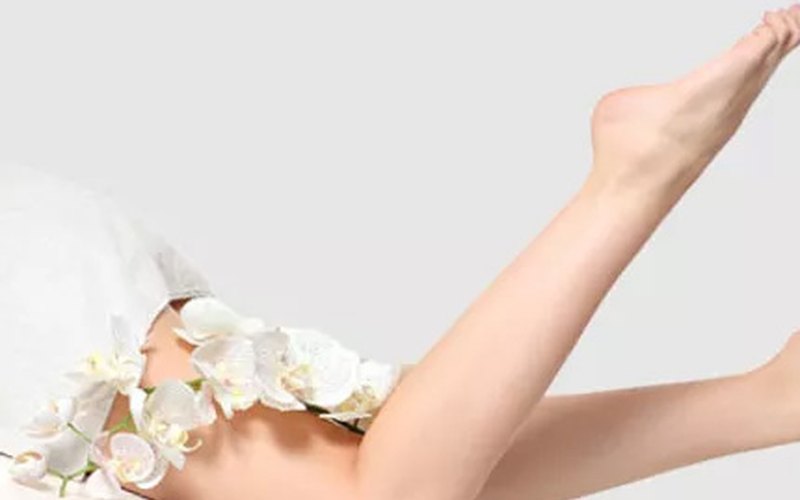 Laser hair removal treatment being performed